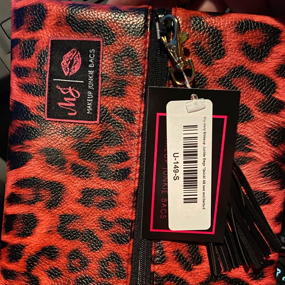 Pink animal print makeup junkie bag